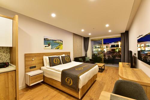 Postel nebo postele na pokoji v ubytování Jasmin Elite Residence & SPA