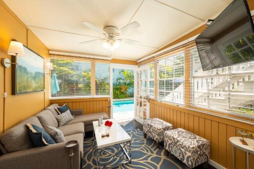 a living room with a couch and a table at Rose Lane Villas in Key West