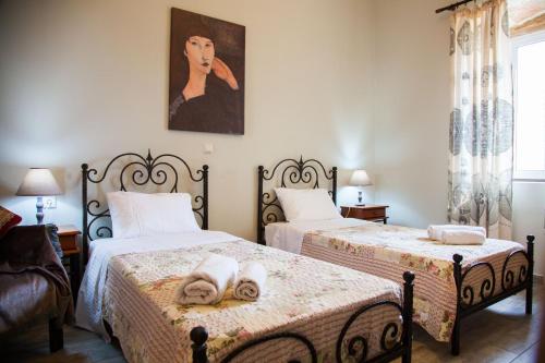 Postel nebo postele na pokoji v ubytování Villa Maria Kefalonia