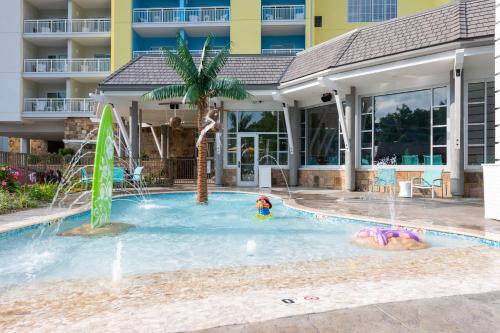 a pool at a hotel with a girl in the water at Margaritaville Resort Gatlinburg in Gatlinburg