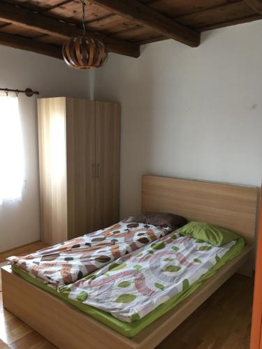 Posteľ alebo postele v izbe v ubytovaní Arácsi házikó