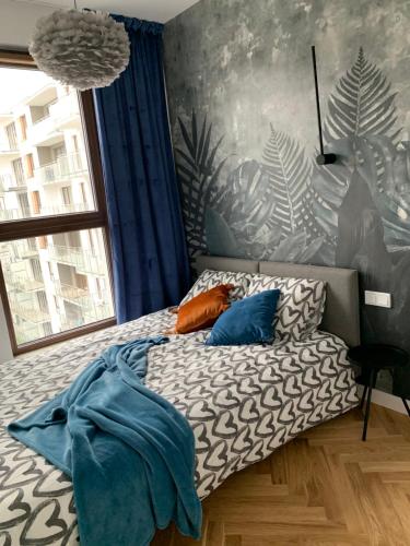 Posteľ alebo postele v izbe v ubytovaní Apartamenty Wola Goleszowska