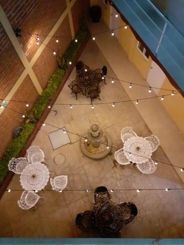 an overhead view of a patio with lights and tables at Hotel Gesa in Villa Corona
