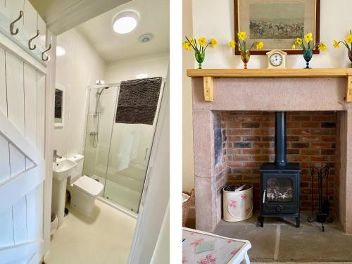 La salle de bains est pourvue d'une cheminée et d'une cuisinière. dans l'établissement Akeld Cottage, à Akeld