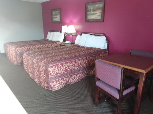 Ένα ή περισσότερα κρεβάτια σε δωμάτιο στο America's Best Value Inn Clarksdale