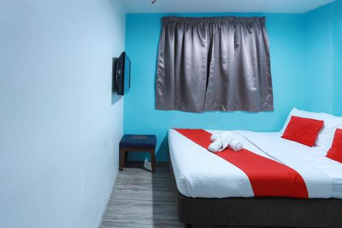 Ein Bett oder Betten in einem Zimmer der Unterkunft Hotel Aman- Nilai & KLIA