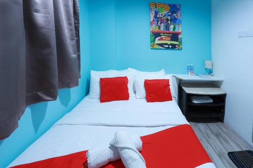 Ein Bett oder Betten in einem Zimmer der Unterkunft Hotel Aman- Nilai & KLIA