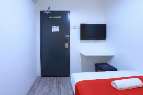 Ein Bett oder Betten in einem Zimmer der Unterkunft Hotel Aman- Nilai & KLIA