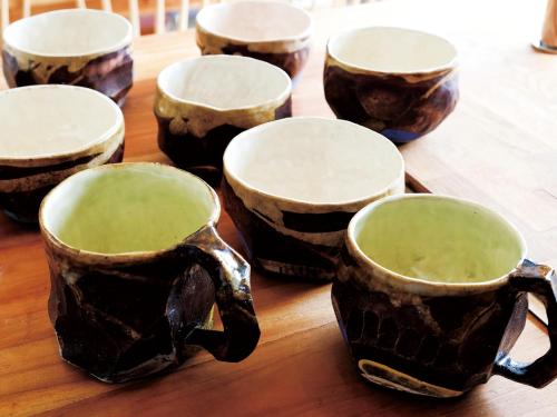 a group of cups sitting on top of a table at CHULAX OKINAWA YOMITAN【Designer Condominium Hotel】 in Yomitan