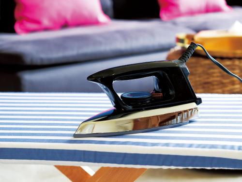 a telephone sitting on top of a table at CHULAX OKINAWA YOMITAN【Designer Condominium Hotel】 in Yomitan