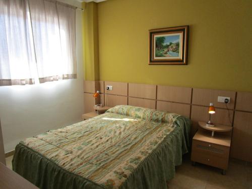 Cama o camas de una habitación en Apartamentos Marina Park