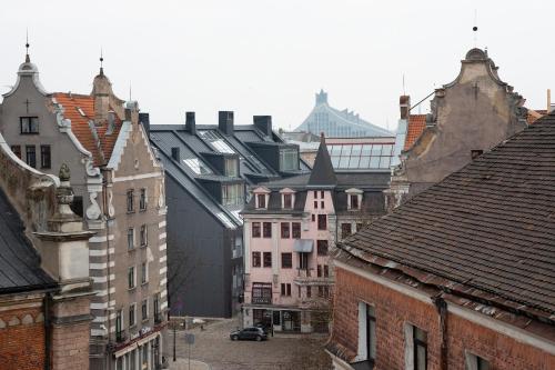 a view of a city with buildings and roofs at Redstone Apartments in Rīga