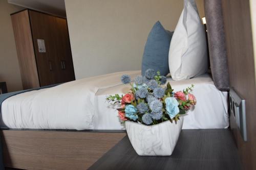 Ένα ή περισσότερα κρεβάτια σε δωμάτιο στο Sara Boutique Hotel