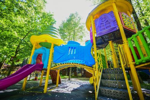a playground with colorful chairs and a slide at Naturkoy Sapanca in Sakarya