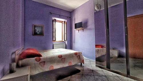 Postel nebo postele na pokoji v ubytování La Casa Colorata