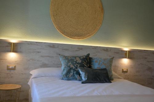 Un ou plusieurs lits dans un hébergement de l'établissement Hotel Maison del Sole