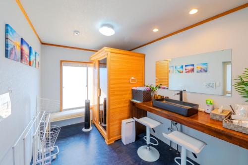 a bathroom with a sink and a mirror at HOUSE K in Ichinomiya
