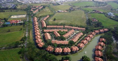 an aerial view of a house with a river at Modern Bali Resort by HostaHome, 10mins to Legoland in Nusajaya