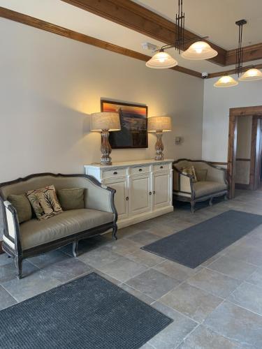 a living room with two couches and a tv at Highland House 207 Slopeside, Village Area, Ski in out in Snowshoe