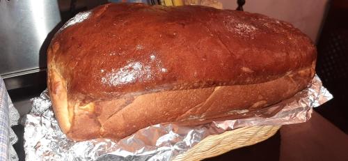 a large loaf of bread sitting on top of tin foil at Hotel Rural Posada Los Caballeros in Almagro