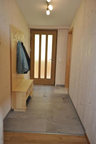 a hallway of a house with a door and a room with a floor at Ferienwohnungen Holzidylle in St. Wolfgang