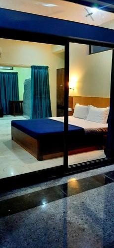 Postel nebo postele na pokoji v ubytování Hotel Agni