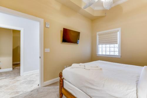 a bedroom with a white bed and a window at South Beach in Ocean City