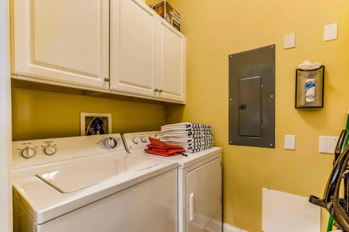 a laundry room with a sink and a washing machine at South Beach in Ocean City