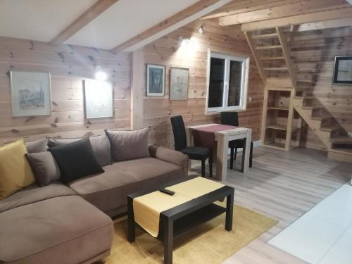a living room with a couch and a table at Mountain village in Žabljak
