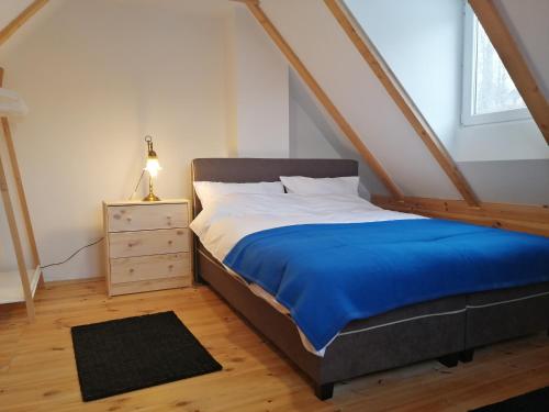 a bedroom with a bed and a dresser and a window at Mountain village in Žabljak