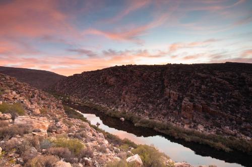an aerial view of a river in a canyon at Mount Ceder in Cederberg