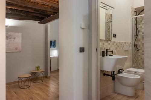 a bathroom with a white sink and a toilet at Residenza San Leonardo - Viterbo Centro Storico in Viterbo