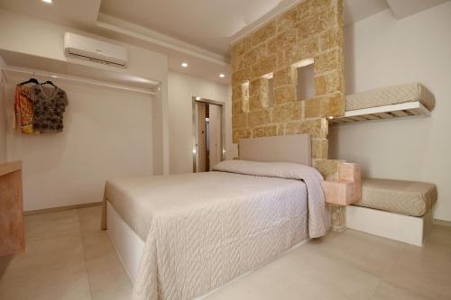 Katil atau katil-katil dalam bilik di San Gabriele Relais