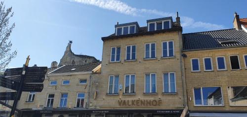 a tall brick building with a window on top of it at Valkenhof in Valkenburg