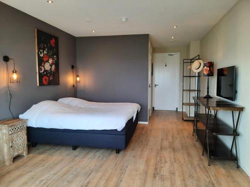 Cama o camas de una habitación en Hof van Renesse