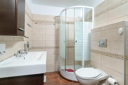 a bathroom with a toilet and a sink at Giotas Sea View Apartment in Skala Kallirakhis