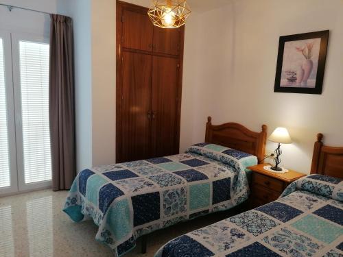 Un pat sau paturi într-o cameră la Apartamento rural Alborada