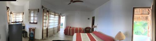 Кровать или кровати в номере Bungalows Lydia San Pancho
