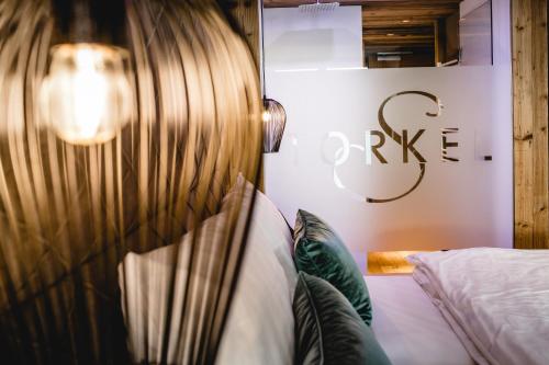 a bedroom with a bed and a sign that reads private at Hotel Restaurant Spa Torkel in Nonnenhorn