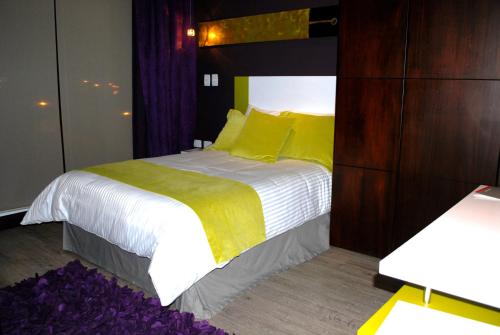 Cama o camas de una habitación en Rioné Hotel Boutique
