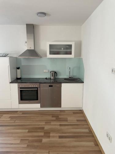 a small kitchen with a sink and a microwave at Oaza in Jelah