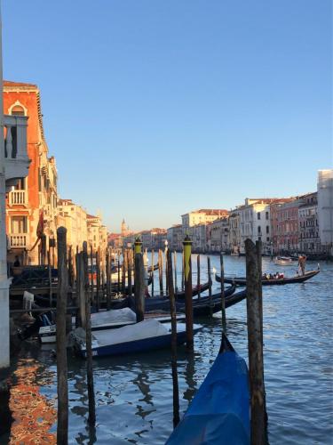 a group of boats are docked in the water at Ca Dode Grand Canal in Venice