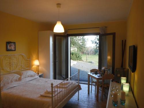 Ένα ή περισσότερα κρεβάτια σε δωμάτιο στο Locanda Degli Etruschi