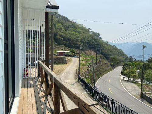 a balcony of a house with a view of a road at Evi Bnb in Fanlu