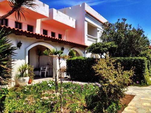 a house with a garden in front of it at Irene Villa in Ierápetra