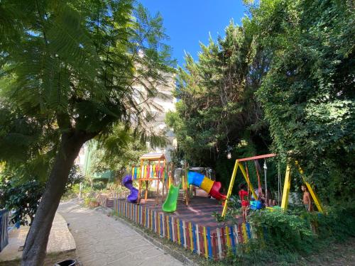 a playground in a park with at Melissa Garden Apart Hotel in Side