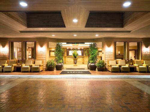 a lobby with couches and chairs in a building at Hyatt Vacation Club at the Welk, San Diego in Escondido