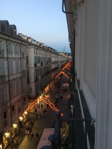 a view of a city street with people and lights at Via Garibaldi 31 Suites in Turin