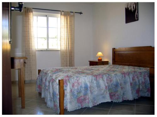 En eller flere senger på et rom på Apartamentos Vivenda Veiguinha