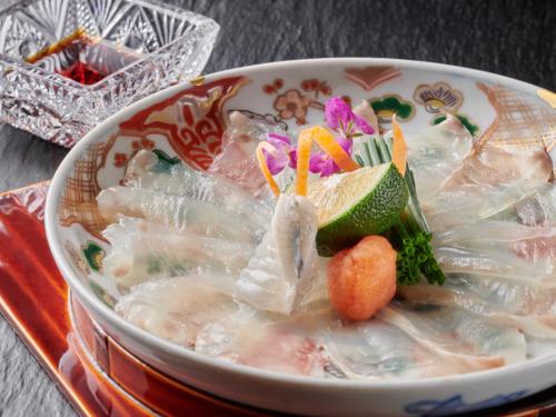 a bowl of soup with noodles and vegetables in it at Mansuirou in Misasa